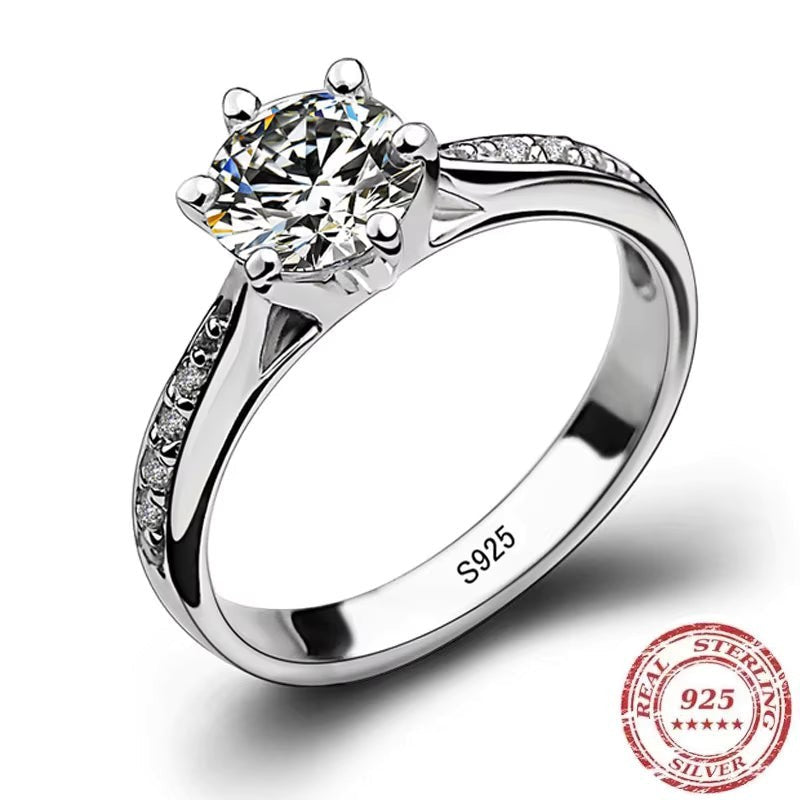 My Store solitaire engagement ring in sterling silver with a six-prong setting and pavé accented shoulders