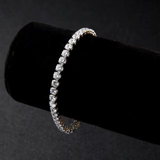 My Store elegant tennis bracelet featuring a continuous row of sparkling clear crystals on a black velvet display stand