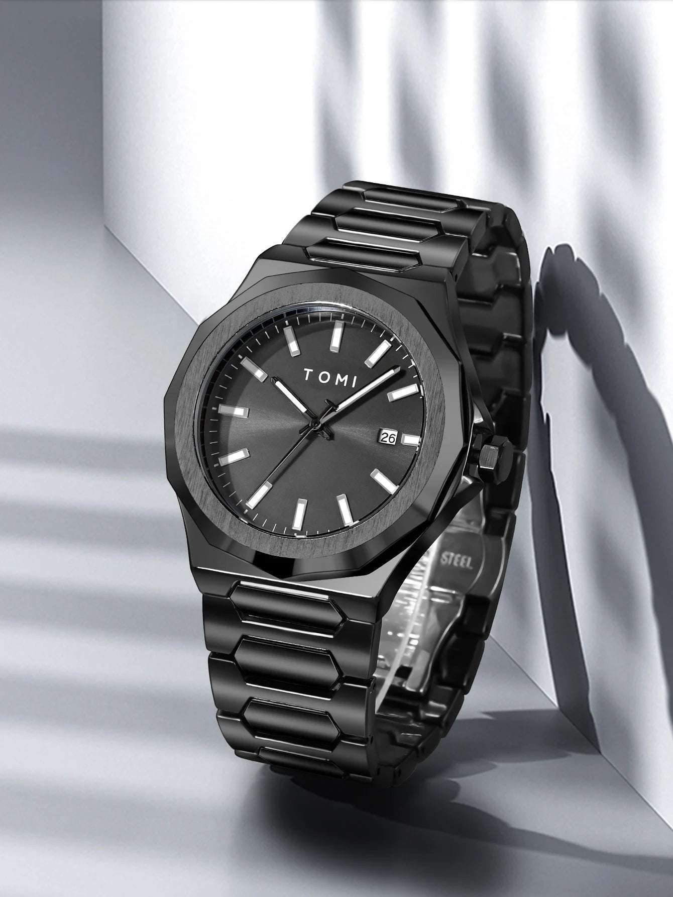 My Store TOMI luxury all-black stainless steel wristwatch with a minimalist dial and date window.
